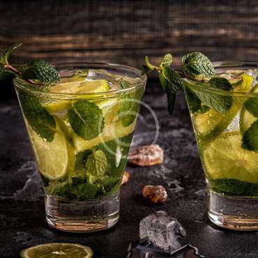 Mojito cocktail with lime and mint, selective focus.